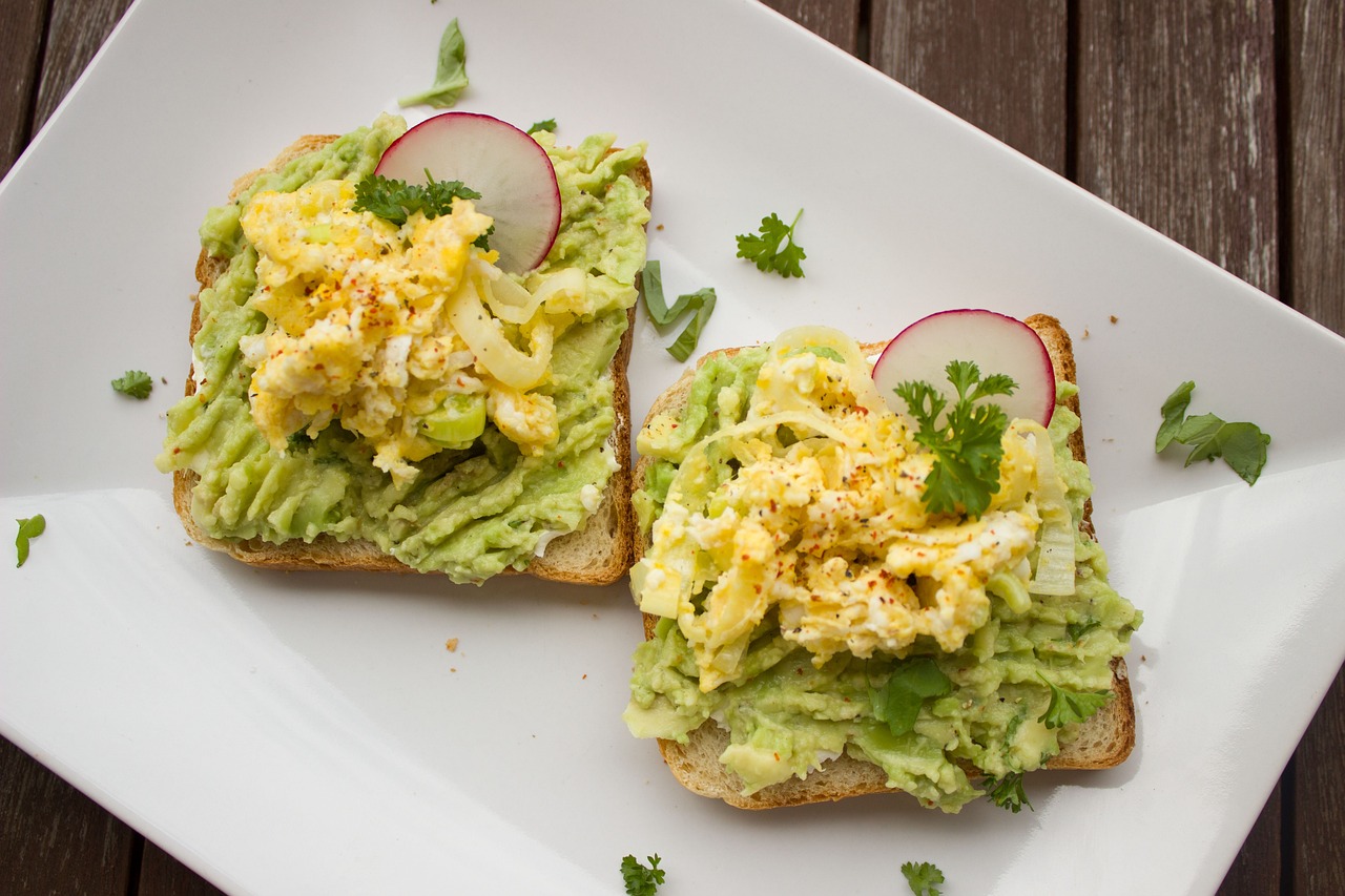 plated avocado toast garnished with parsley