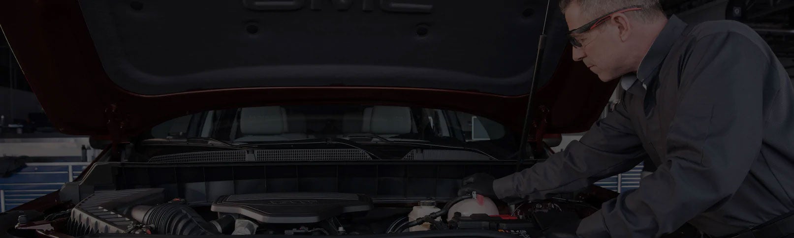 GM Service Technician performing oil change on vehicle